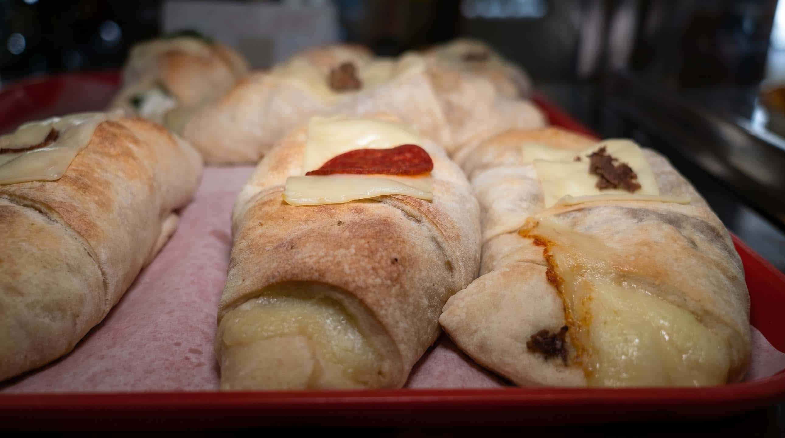 Golden-baked strombolis and calzones filled with cheese and meats